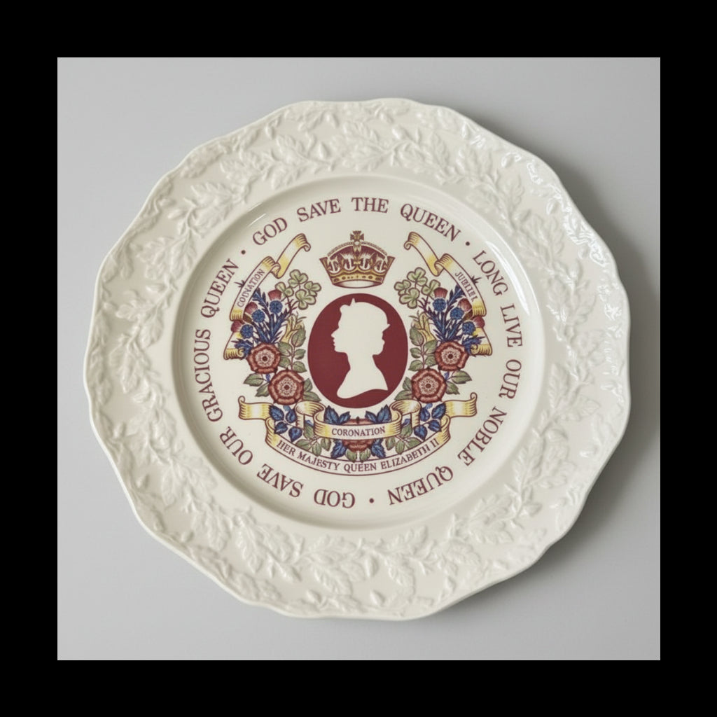 Decorative plate with royal emblem and text on a green fabric background