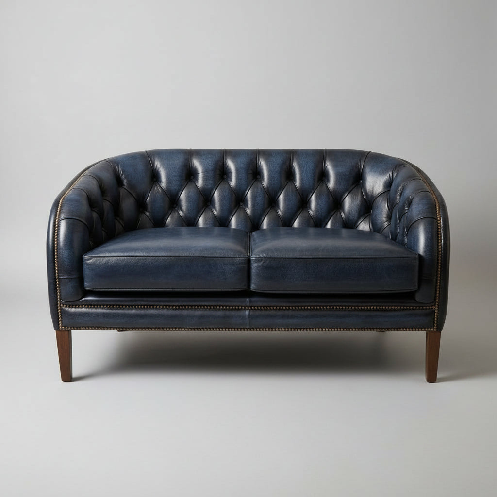 Blue leather sofa against a beige wall