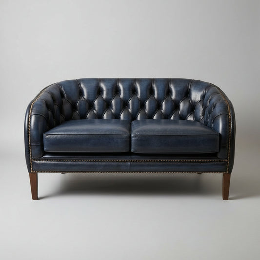 Blue leather sofa against a beige wall