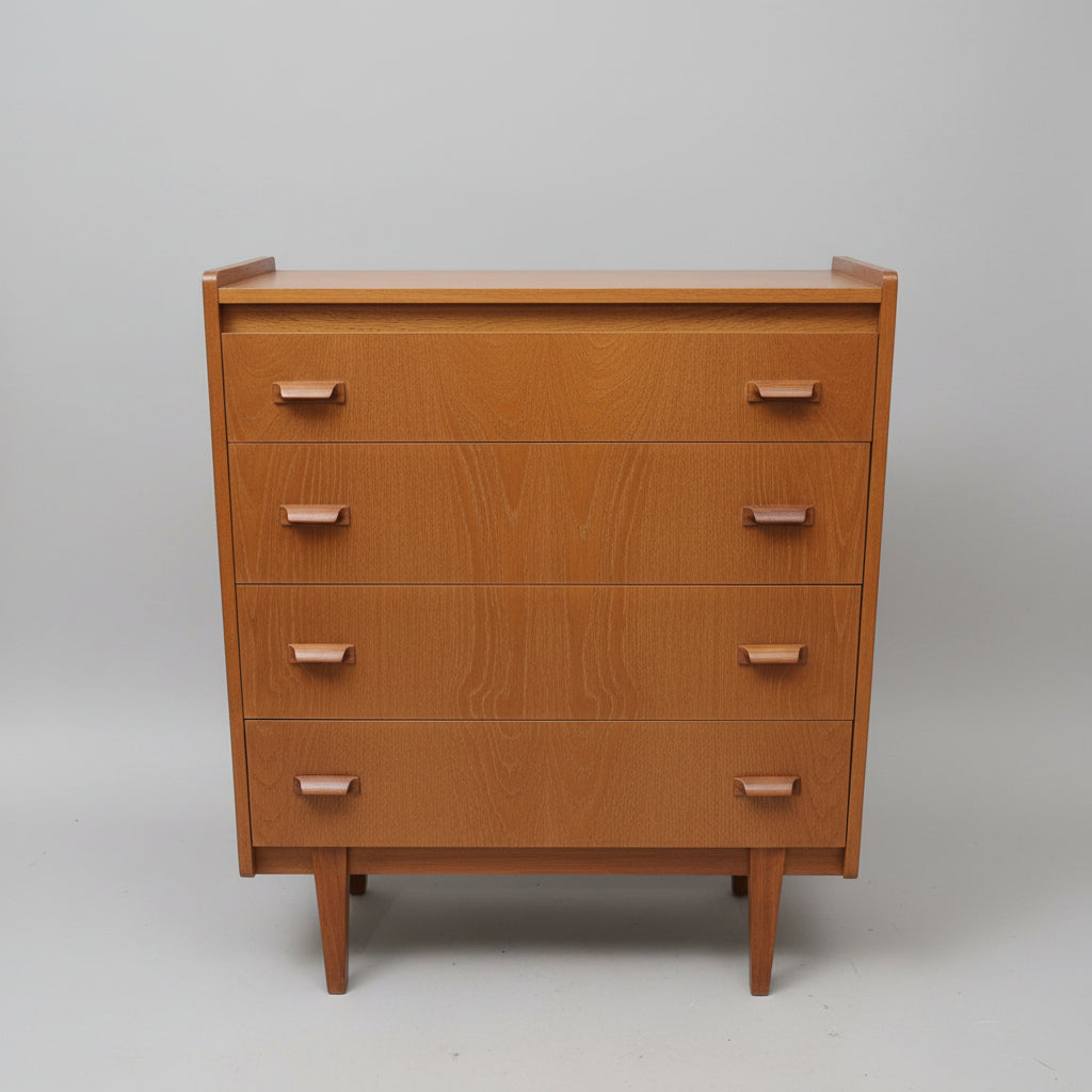 Mid-century modern wooden chest of drawers with five drawers and tapered legs, shown in a furniture store setting.