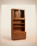 Wooden bookshelf with glass doors and drawers on a beige background