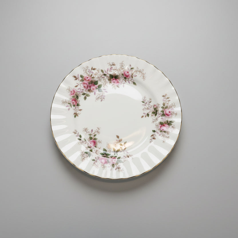 Decorative plate with floral patterns on a wooden surface