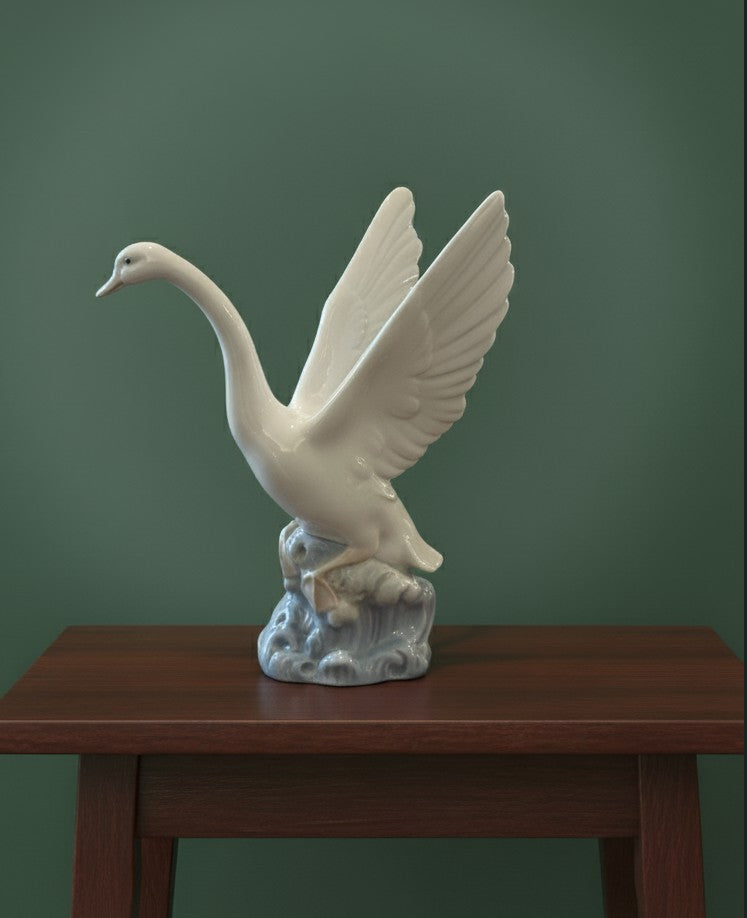 NAO by Lladro  Porcelain figurine of a swan with its wings raised