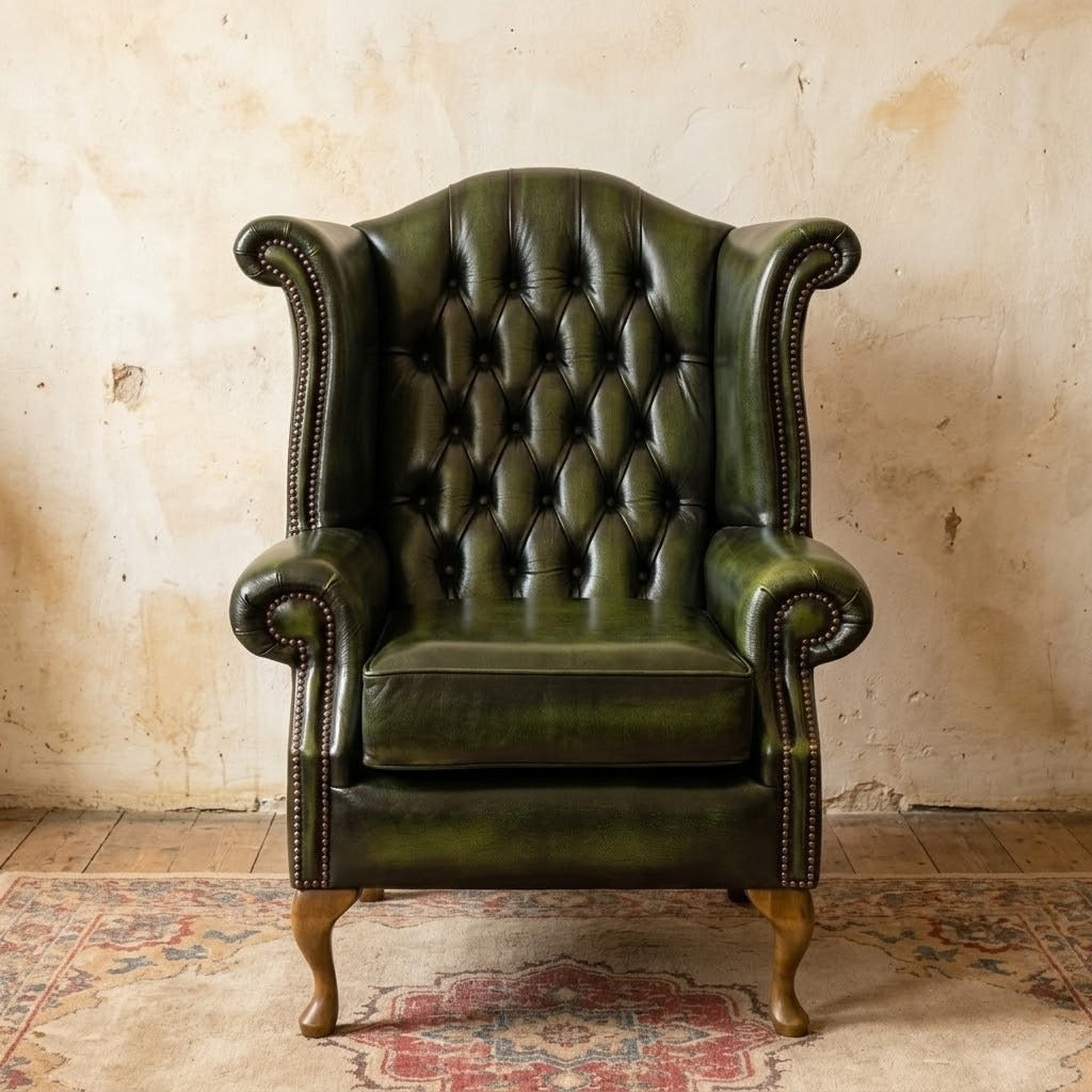Green leather armchair against a textured wall
