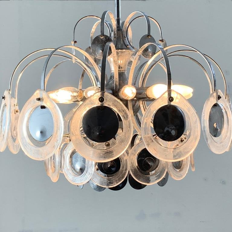 Chandelier with circular design on a light gray background