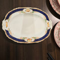 This is an Alfred Meakin oval serving platter in the Caledonia (Scalloped) pattern