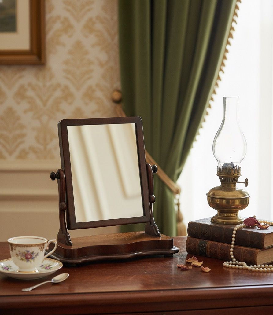 Wooden vanity mirror on a table with a cup, saucer, and oil lamp in a room setting.