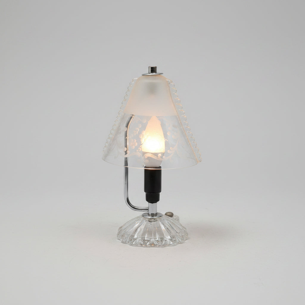 Decorative wall sconce with intricate design on a wooden surface.