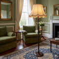 A STANDARD LAMP WITH TURNED COLUMN AND SHADE