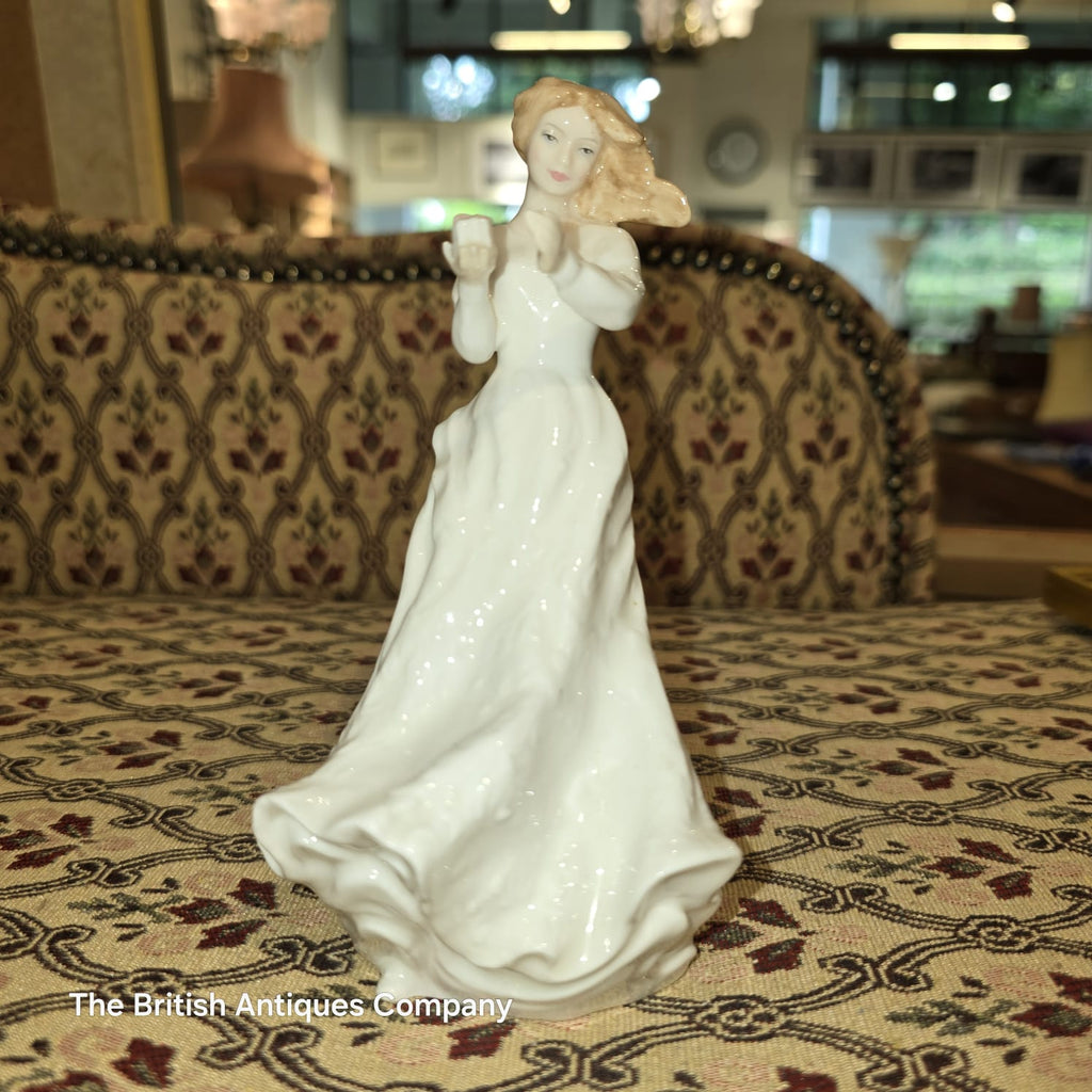 Elegant Porcelain Figurine of a Lady with Flowing Hair