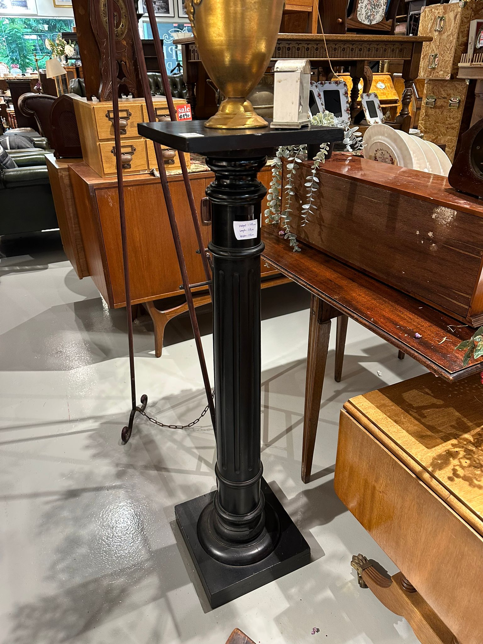A late 19th Century ebonised torchere with fluted turned pedestal column, height 105cm,