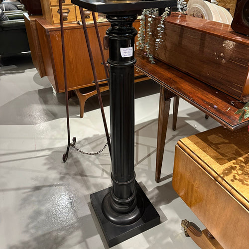 A late 19th Century ebonised torchere with fluted turned pedestal column, height 105cm,