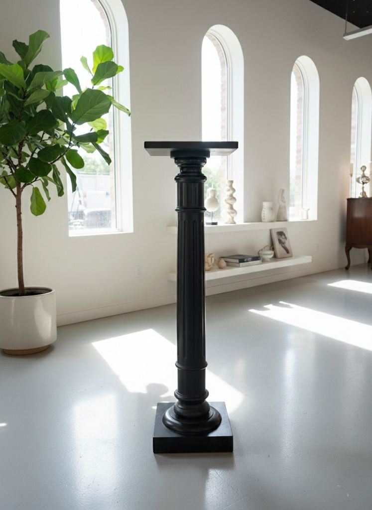 A late 19th Century ebonised torchere with fluted turned pedestal column, height 105cm,