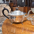 Antique Regency Silver Plated Teapot – Lobed Body, Four Scroll Feet & Ebonised Handle, c.1820–1860