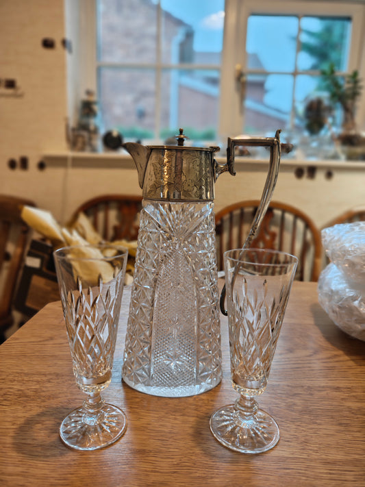 Edwardian pitcher with silver plated handle and lid. Pair with a pair of Waterford crystal glass on stem feet