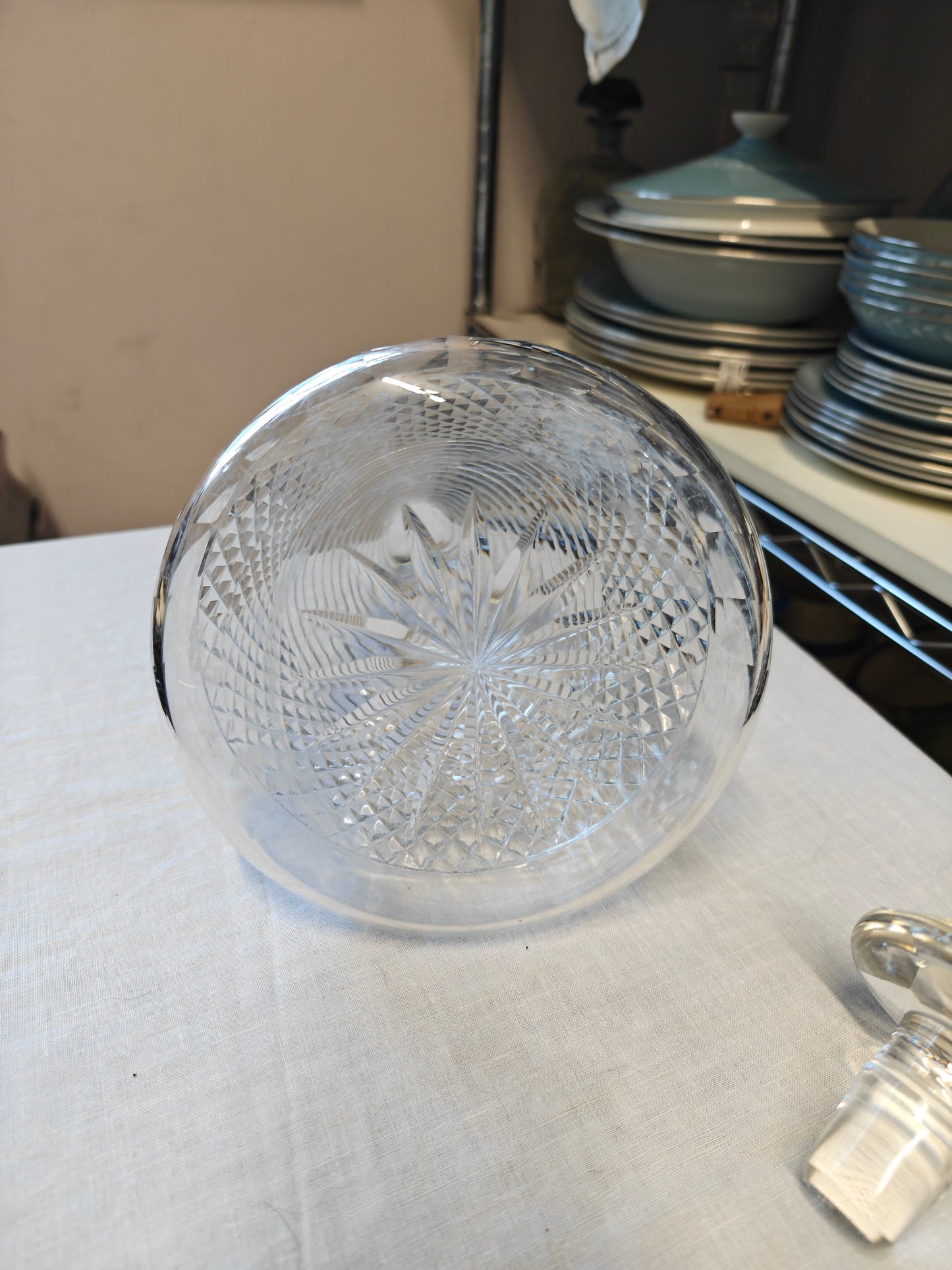 19th century crystal ships decanter with a diamond cut pattern on the base and a stepped prism design on the neck