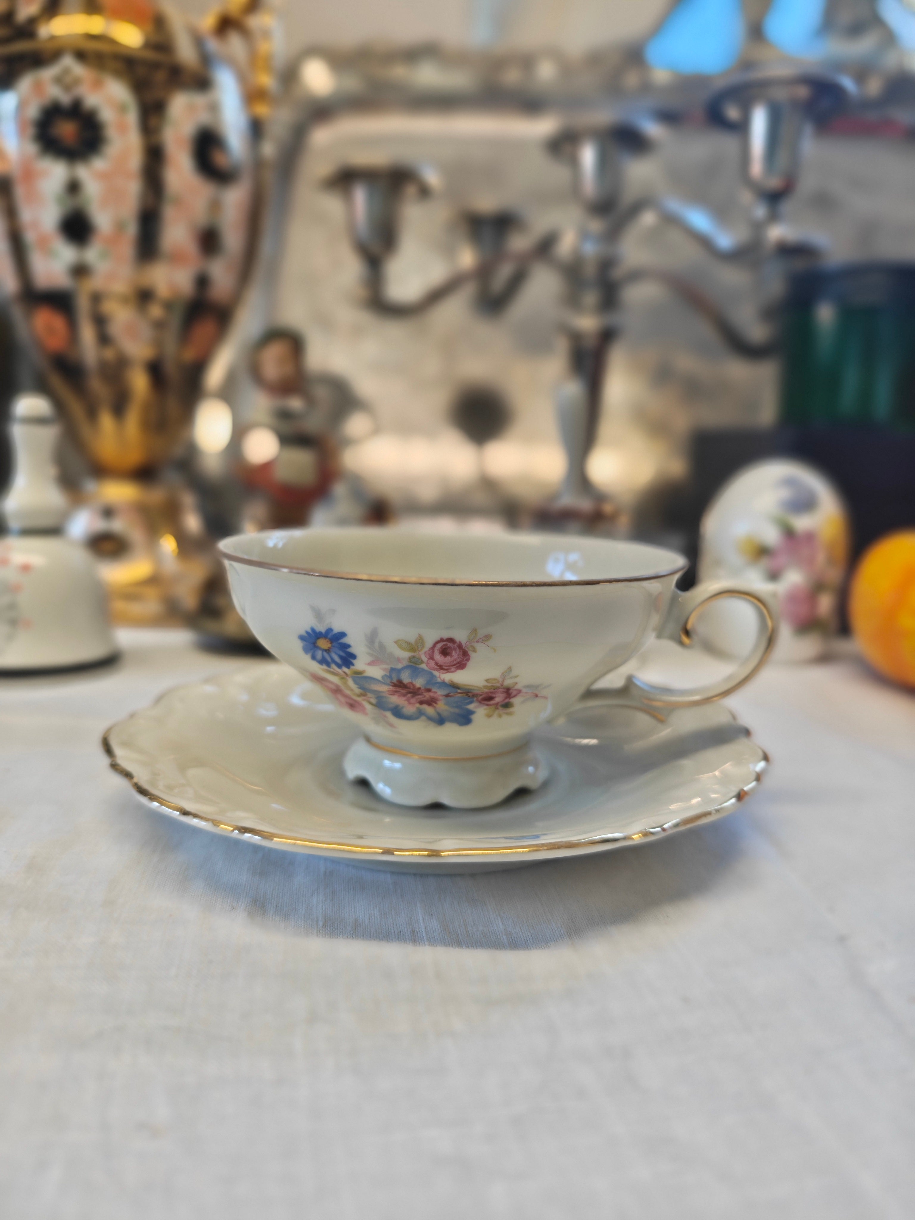 Vintage Bavarian embossed pedestal-foot tea cup and saucer