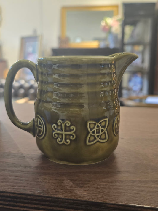 Green ceramic milk jar