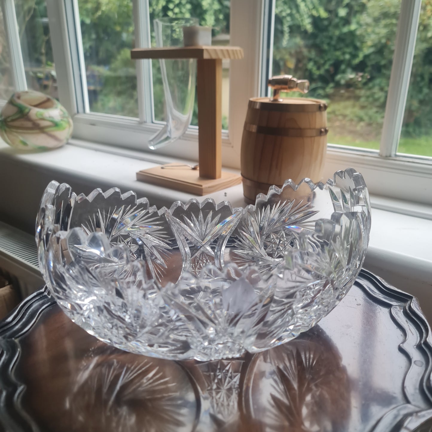 Lovely vintage heavy hand-cut crystal bowl with a starburst, pinwheel, and fan design.