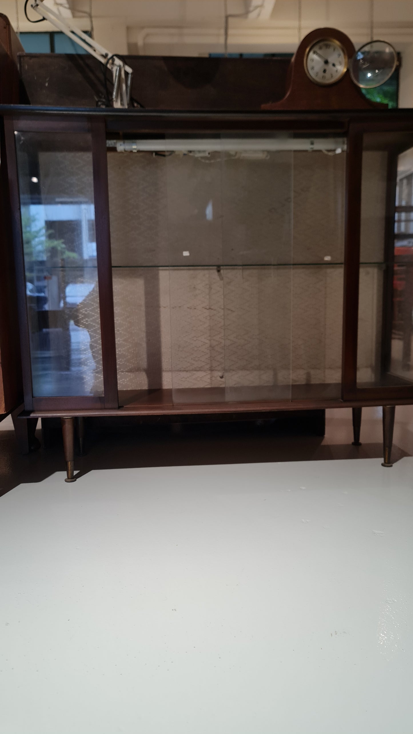 A Hubbinet 1960's glass display cabinet