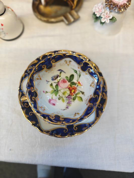 French Antique porcelain cup and saucer in rocaille style