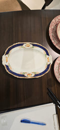 This is an Alfred Meakin oval serving platter in the Caledonia (Scalloped) pattern
