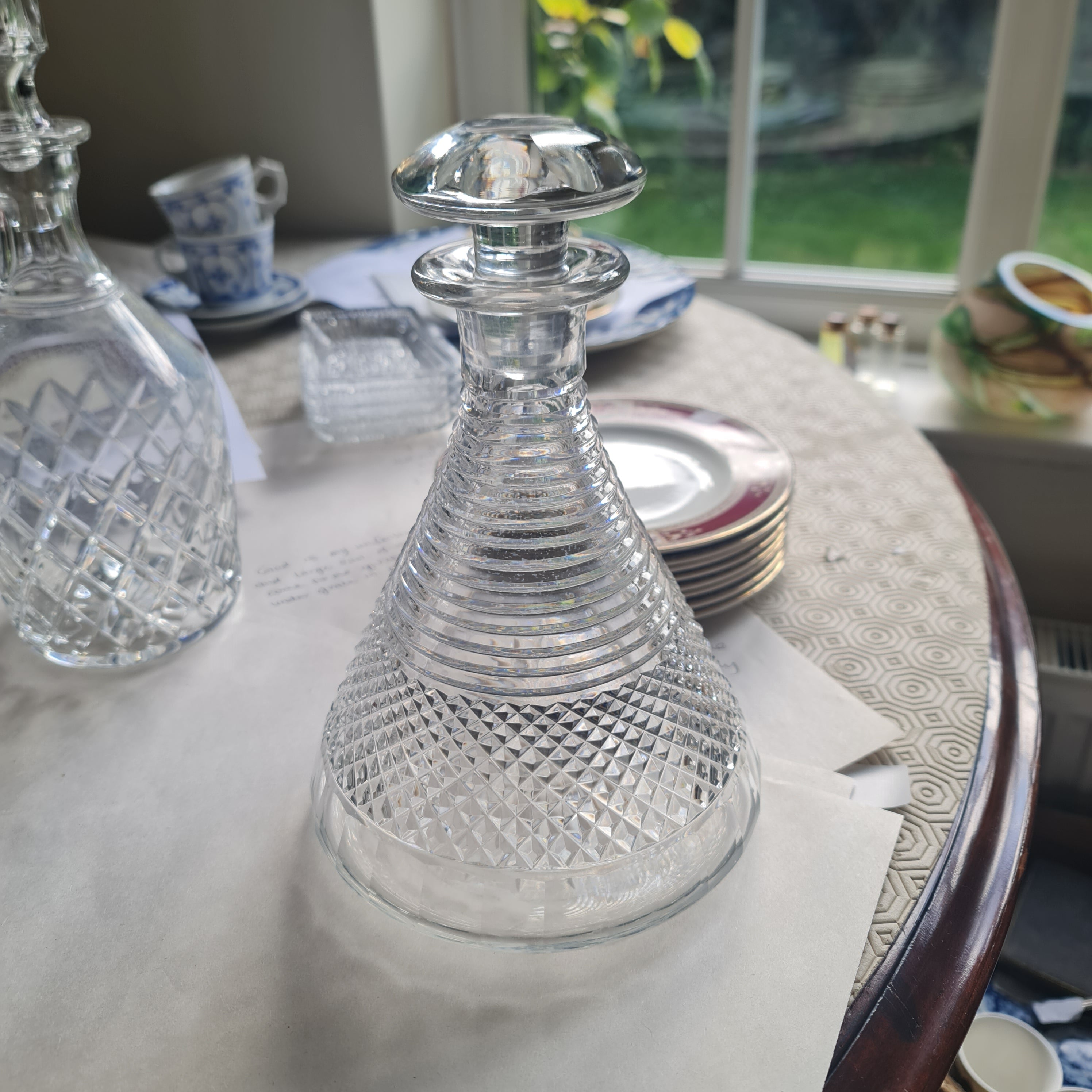 19th century ships decanters and stoppers
the ribbed necks above hobnail cut bands, 23cm high
