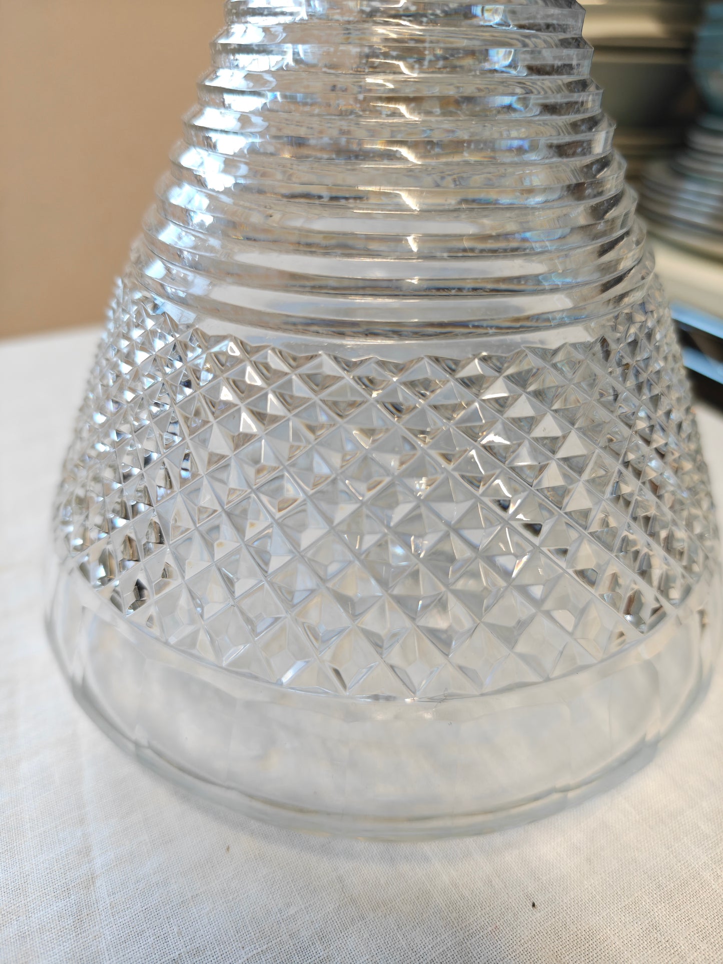 19th century crystal ships decanter with a diamond cut pattern on the base and a stepped prism design on the neck
