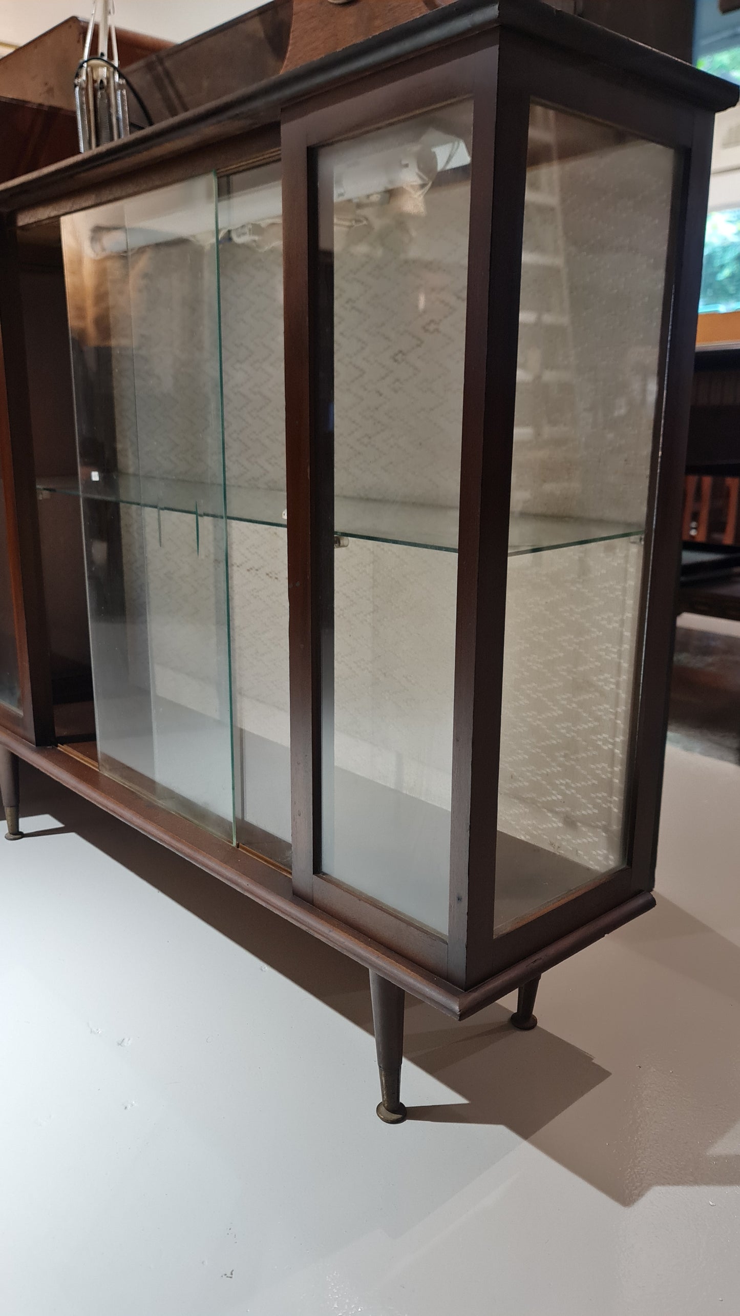 A Hubbinet 1960's glass display cabinet