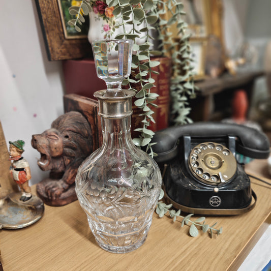High Quality Vintage crystal decanter with a sterling silver collar.