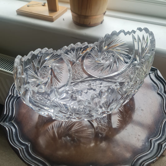 Lovely vintage heavy hand-cut crystal bowl with a starburst, pinwheel, and fan design.