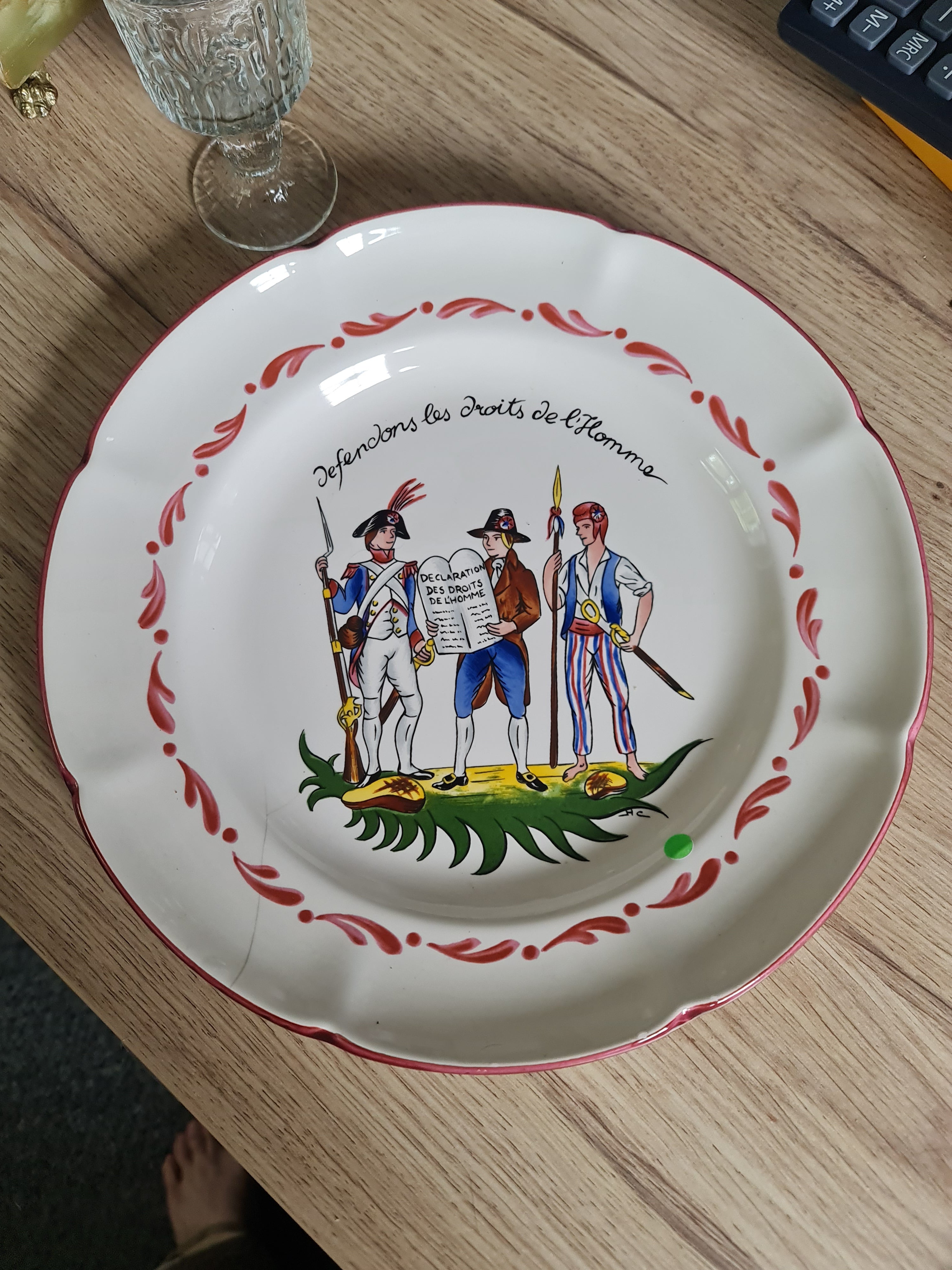 French potter St. Clement, a French Revolution themed plate. Small cracks line on plate