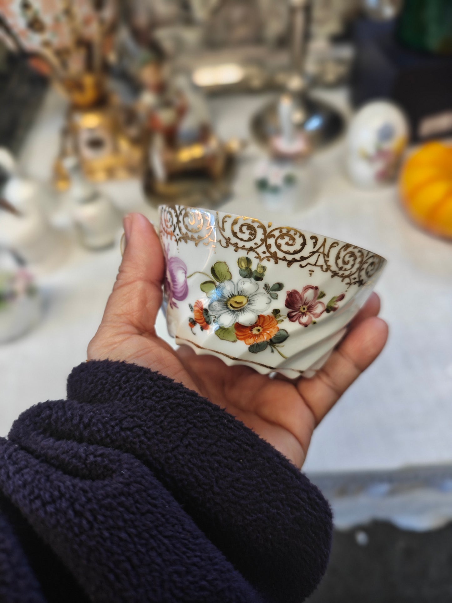 Dresden tea cup and saucer set features a delicate floral design with intricate gold accents