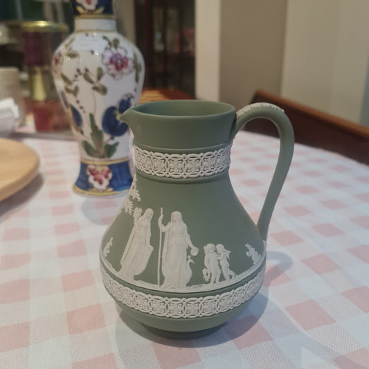 1908 Wedgwood Jasperware cream on green jug