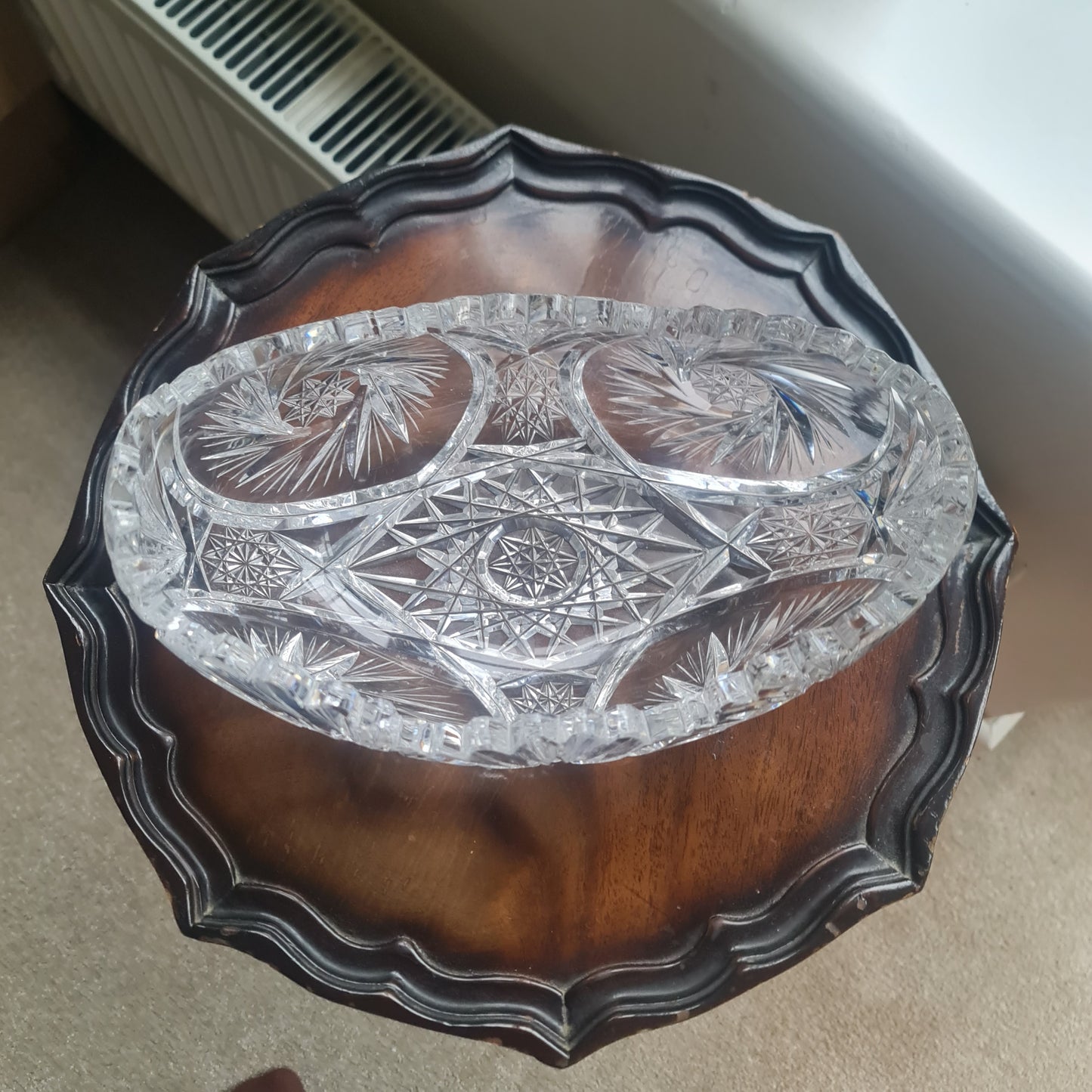Lovely vintage heavy hand-cut crystal bowl with a starburst, pinwheel, and fan design.