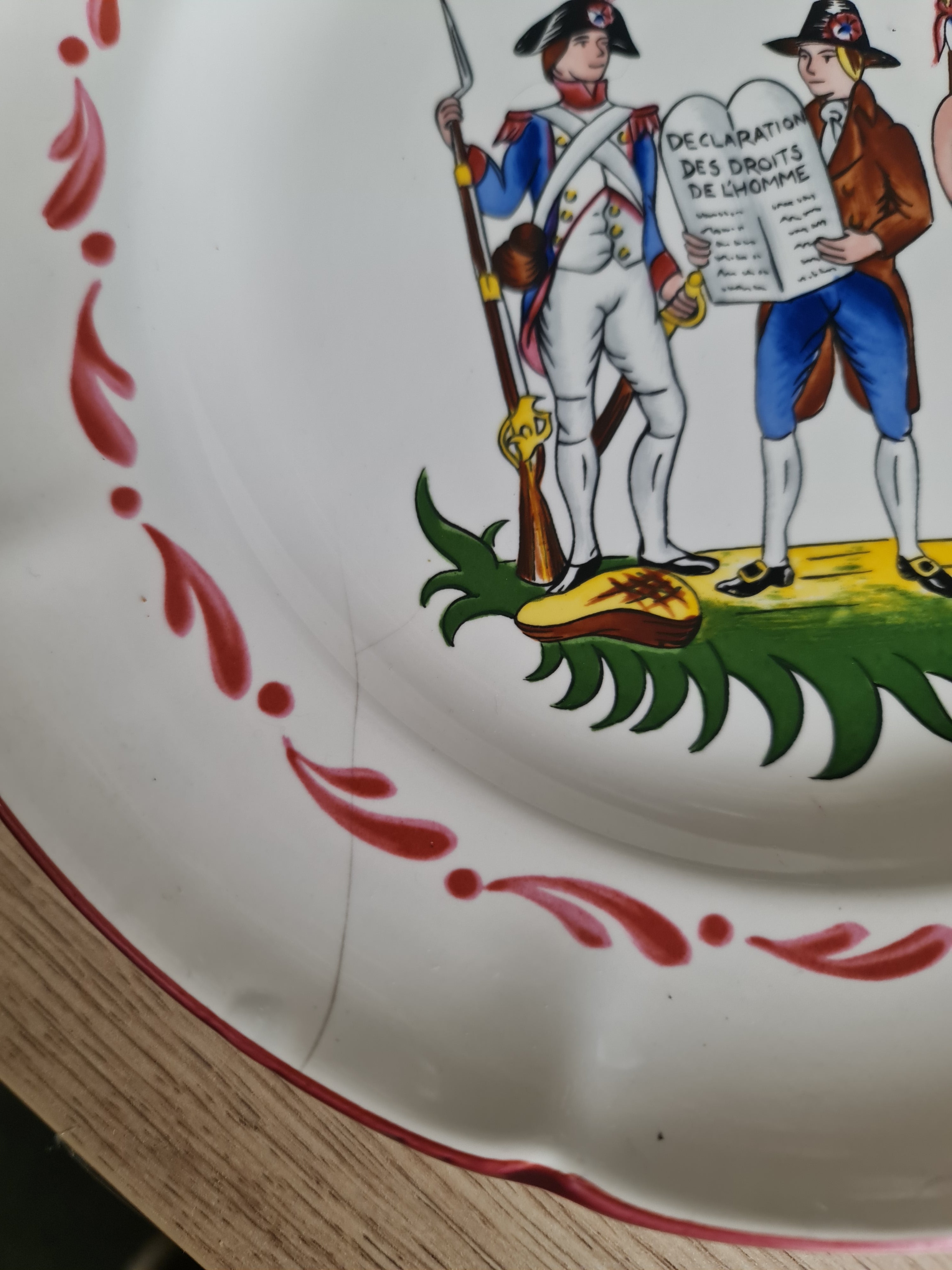 French potter St. Clement, a French Revolution themed plate. Small cracks line on plate
