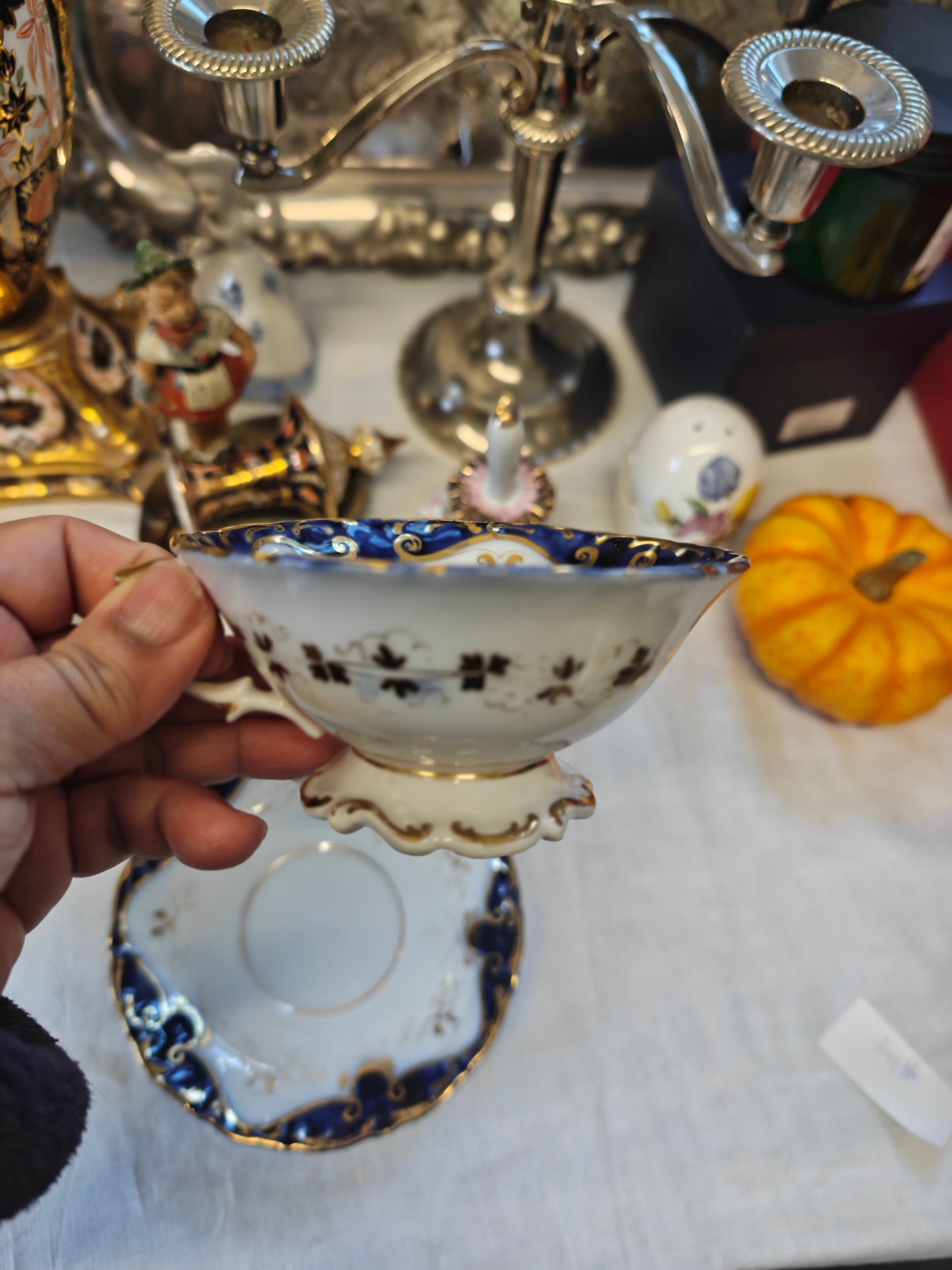 French Antique porcelain cup and saucer in rocaille style