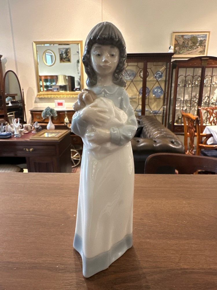 NAO by Lladro porcelain figurine of a girl holding a puppy