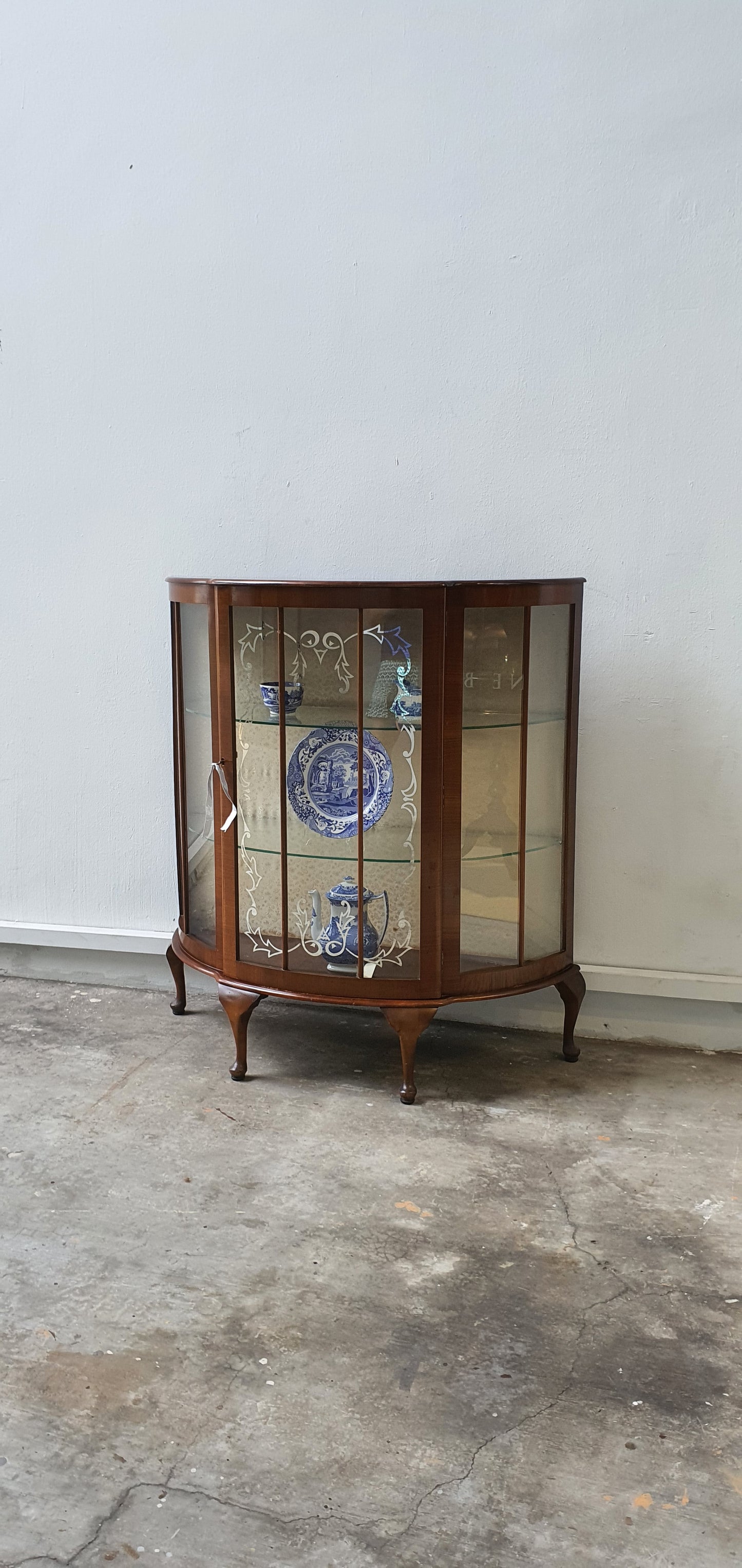 Vintage Bow Front display cabinet with pretty glass motif